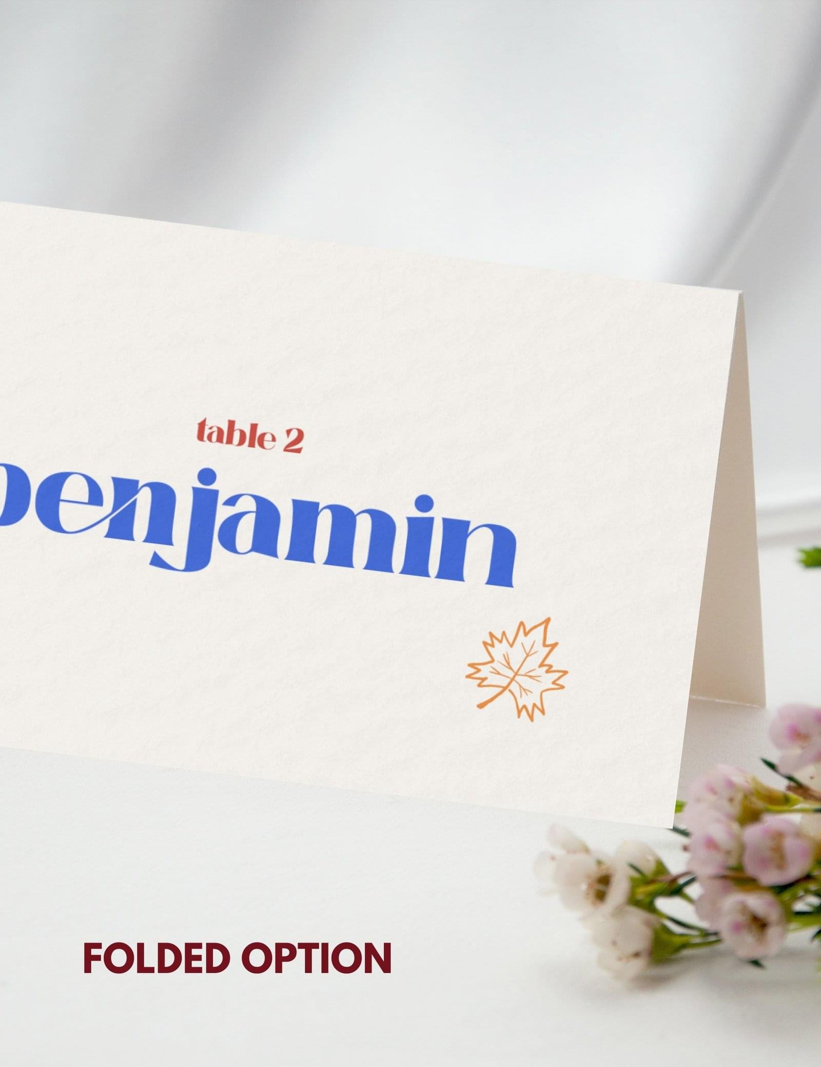 folded place card with maple leave doodle