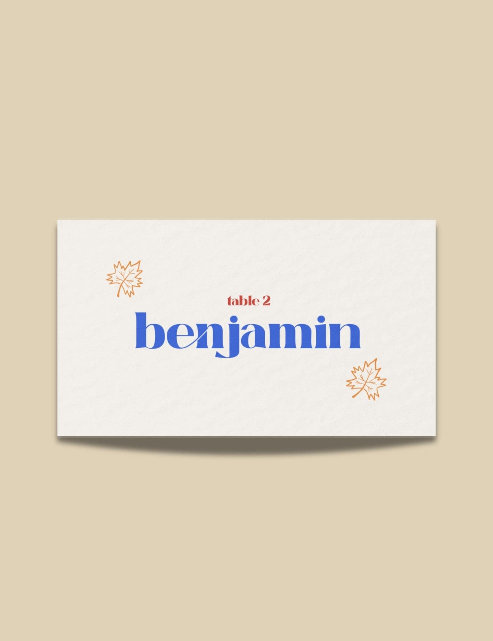 folded place card with maple leave and dinning party items doodle